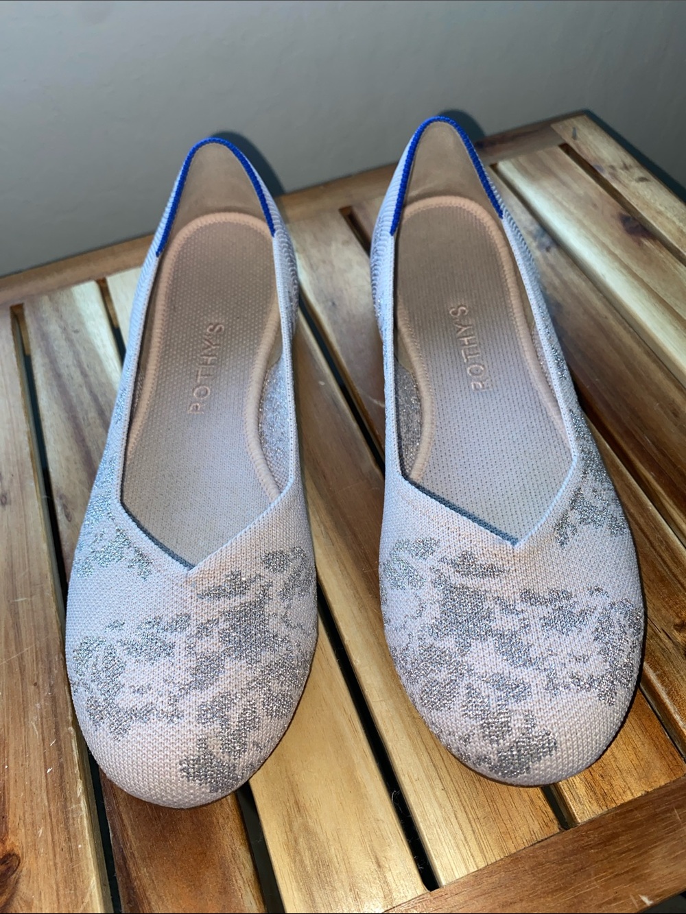 Rothy’s light lavender flats and silver flats
